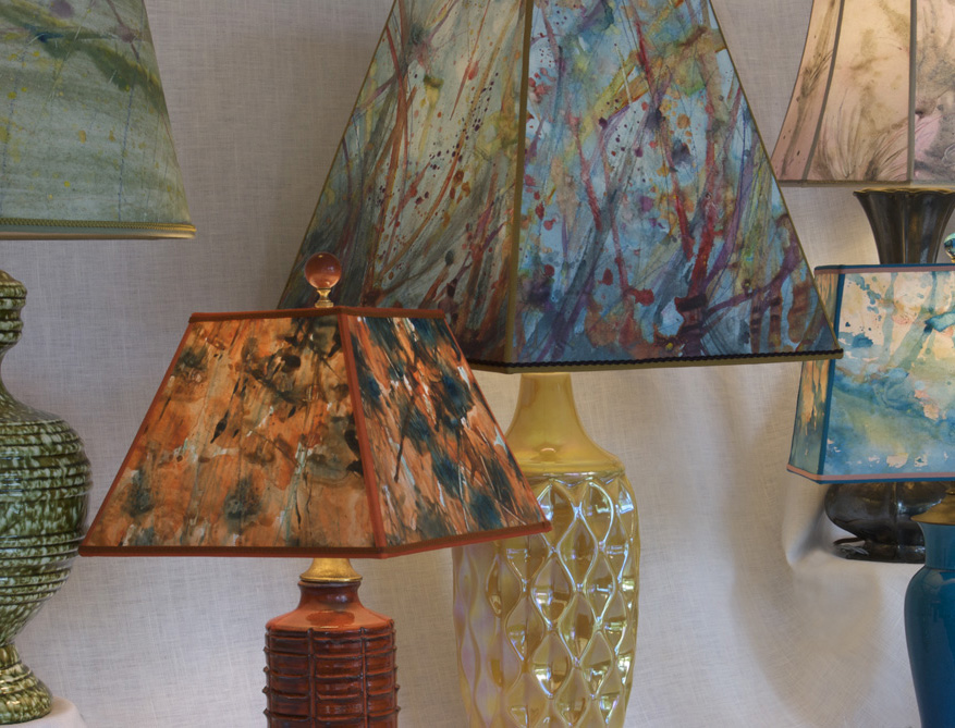 Hand made papers lighting up vintage lamps.